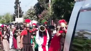 A boy with Downsyndrome comforts Jesus during a Good Friday procession in Mexico