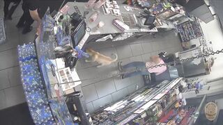 An armed robbery suspect behind the counter of a 7-11 pulled out a handgunb and gets fatally shot by LAPD officers