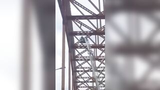 Adrenaline Junkie gets Stuck at Top of Bridge..despite Efforts to Save Him..He can't Hold On
