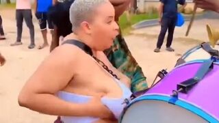 Animalistic Lady thinks God gave her those Boobs to Play Drums and Beat Others with them