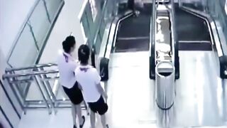Pure Terror, Flooring Breaks at the top of an Escalator. She Saves her Kid but not Herself