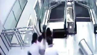 Pure Terror, Flooring Breaks at the top of an Escalator. She Saves her Kid but not Herself