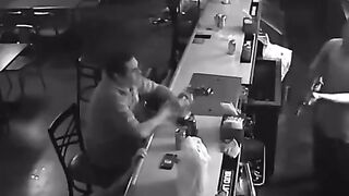 Coolest Man on the Planet stays Calm, Lights a Cigarette as AK-47 Robbery of Bar Goes On (Classic)
