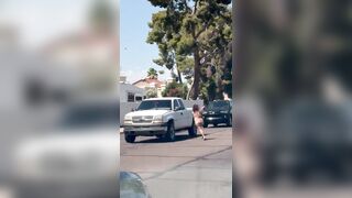 Naked woman, clearly high out of her mind, runs across the street, body slams a truck