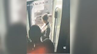 During a train stop, a man tried to step out to smoke, but a staff member stopped him