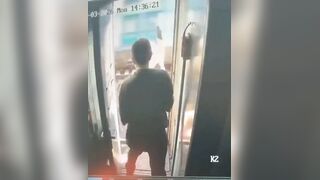 During a train stop, a man tried to step out to smoke, but a staff member stopped him