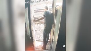 During a train stop, a man tried to step out to smoke, but a staff member stopped him