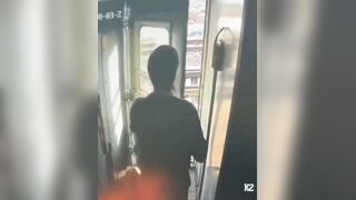 During a train stop, a man tried to step out to smoke, but a staff member stopped him