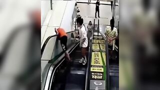 NO don't do that Kid. Poor guy sticks his Head in an Escalator