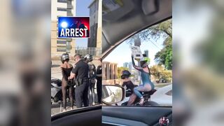 Two women arrested for reckless driving after waving a wild sign and desperately trying to get other drivers’ attention