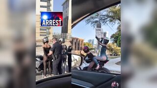 Two women arrested for reckless driving after waving a wild sign and desperately trying to get other drivers’ attention