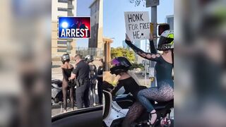 Two women arrested for reckless driving after waving a wild sign and desperately trying to get other drivers’ attention