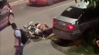 Man uses his Motorcycle Helmet to KO someone who got too Close to his Bike