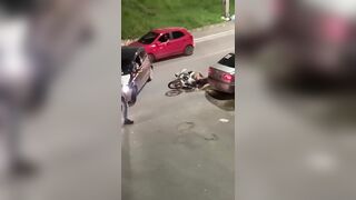 Man uses his Motorcycle Helmet to KO someone who got too Close to his Bike