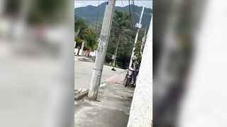 Motorcyclist getting Ready to Ride gets too Close to Power Lines