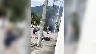 Motorcyclist getting Ready to Ride gets too Close to Power Lines