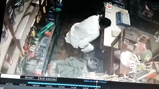 Store Owner Stands and Bows to the Man about to Pump Him Full of Bullets