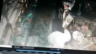 Store Owner Stands and Bows to the Man about to Pump Him Full of Bullets