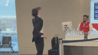 The Delta worker looks genuinely concerned...