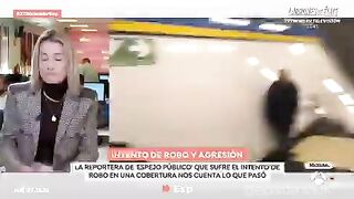African Migrant Robs Female Reporter Live on TV and Threatens to Kill Her.