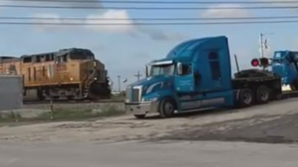Man escapes 18-wheeler seconds before train impact