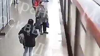 Watch Top of Screen. 60 Year Old man pushes 15 Year Old Boy under the Train