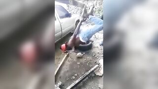 Haitian Police Hang Man Upside Down for Shooting an Officer