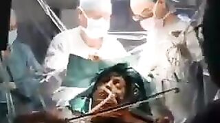 Woman plays the Violin during Brain Surgery for a Reason..See Description
