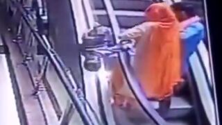 Woman Drops her Baby while on the Escalator..See Description