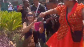 Nigerian woman with bible being assaulted by South African women