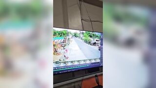 Woman trying to Cross the Road lines up perfectly with Biker
