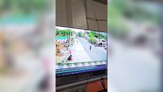 Woman trying to Cross the Road lines up perfectly with Biker
