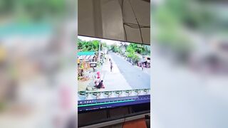 Woman trying to Cross the Road lines up perfectly with Biker