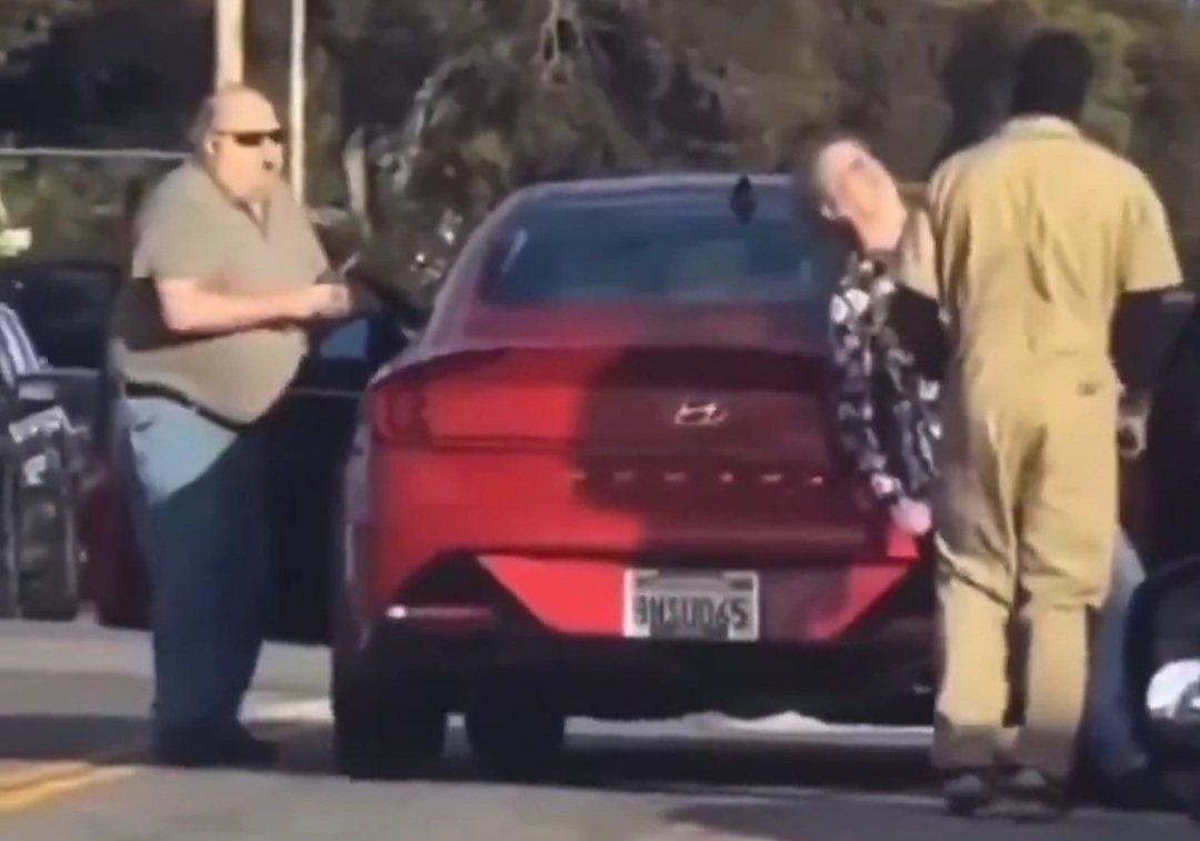 Black man in jumpsuit SLAMS white woman to the concrete after she barely touches his