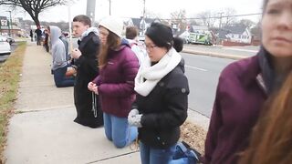 Christendom college students pray the Rosary on their knees outside an abortion clinic in Virginia