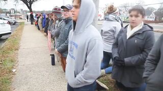 Christendom college students pray the Rosary on their knees outside an abortion clinic in Virginia
