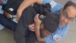 A man is seen trying to take another man’s phone, not realizing the person he approached was a police officer