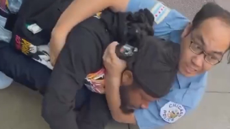 A man is seen trying to take another man’s phone, not realizing the person he approached was a police officer
