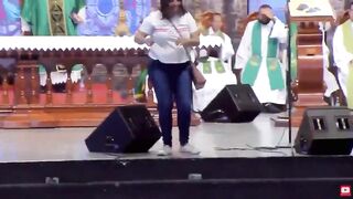 Mental Woman pushes Priest Off Stage during Live Church