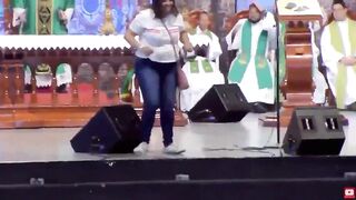 Mental Woman pushes Priest Off Stage during Live Church