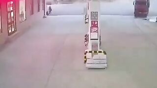 Man tries Stopping Out of Control Truck at Gas Station...Splat