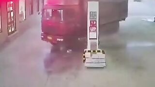 Man tries Stopping Out of Control Truck at Gas Station...Splat