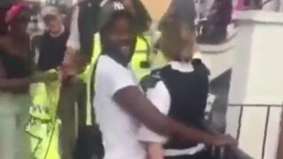 Female British Police seems to be Enjoying Black Man