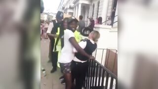 Female British Police seems to be Enjoying Black Man