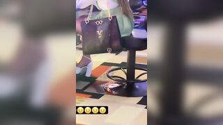 Woman Pissing on the Floor at Casino on the Phone doesn't Care