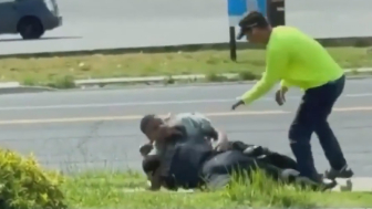Officer and Man Seen Fighting in the Street in Madison