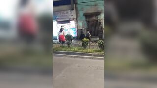 Graphic images: Woman is run over by a minibus after being pushed during a fight