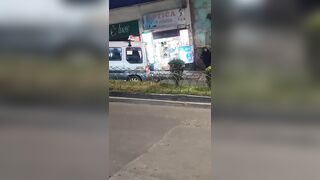 Graphic images: Woman is run over by a minibus after being pushed during a fight