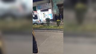 Graphic images: Woman is run over by a minibus after being pushed during a fight