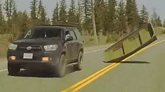 Boat flies off back of truck, smashes into oncoming car
